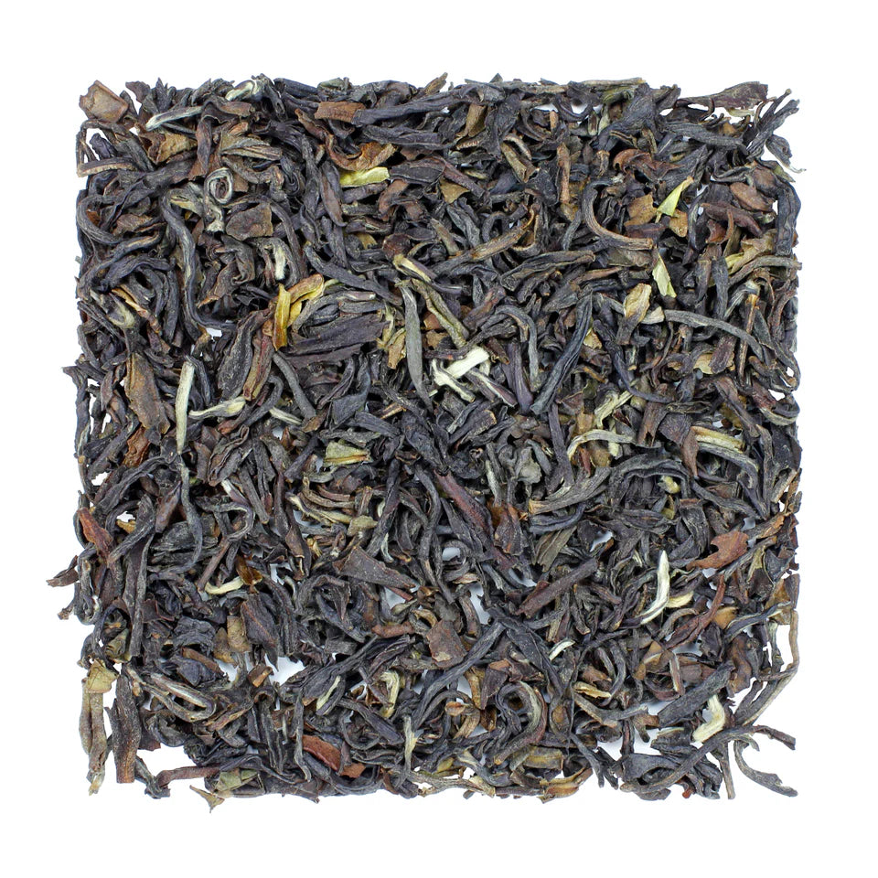 Noteworthy Selections Darjeeling 2nd Flush, Selimbong Estate looseleaf tea on white background.